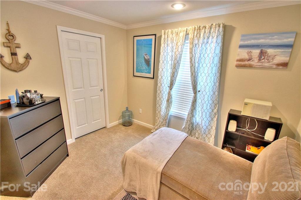 43 Janie Road, Unit 14 Clyde, NC 28721 - Photo 19 of 35 a bedroom with a bed and a dresser