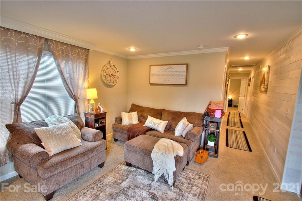 43 Janie Road, Unit 14 Clyde, NC 28721 - Photo 3 of 35 a living room with furniture and a flat screen tv
