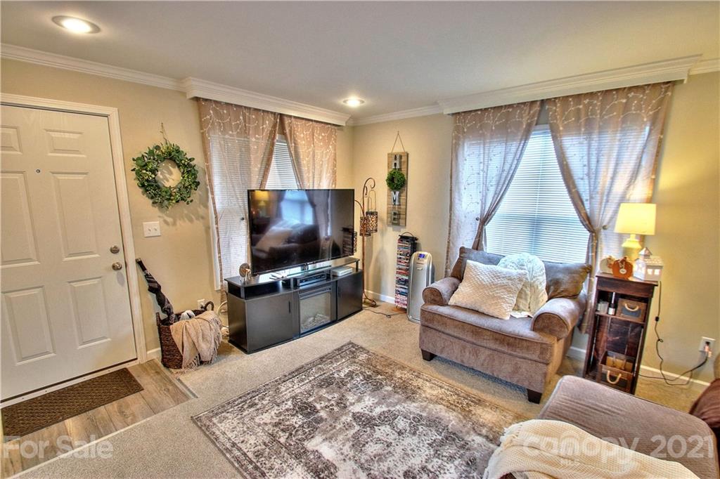 43 Janie Road, Unit 14 Clyde, NC 28721 - Photo 4 of 35 a living room with furniture and a flat screen tv