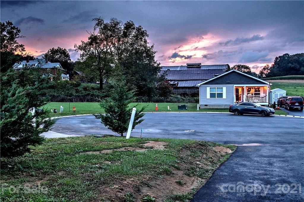 43 Janie Road, Unit 14 Clyde, NC 28721 - Photo 35 of 35 a front view of a house with a yard and a garden