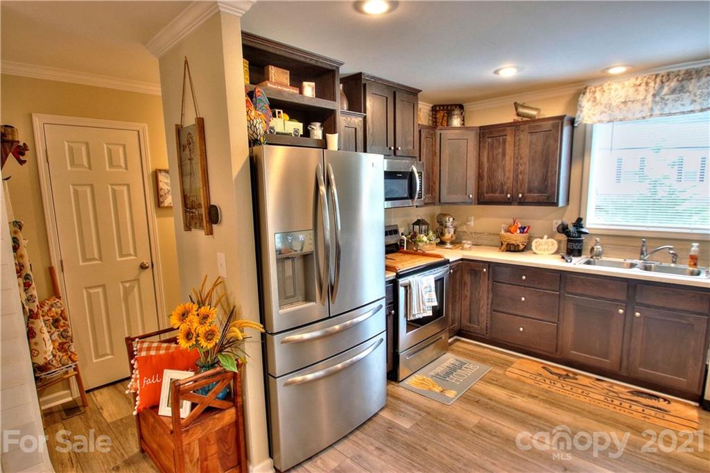 43 Janie Road, Unit 14 Clyde, NC 28721 - Photo 7 of 35 a kitchen with stainless steel appliances granite countertop a refrigerator and a sink