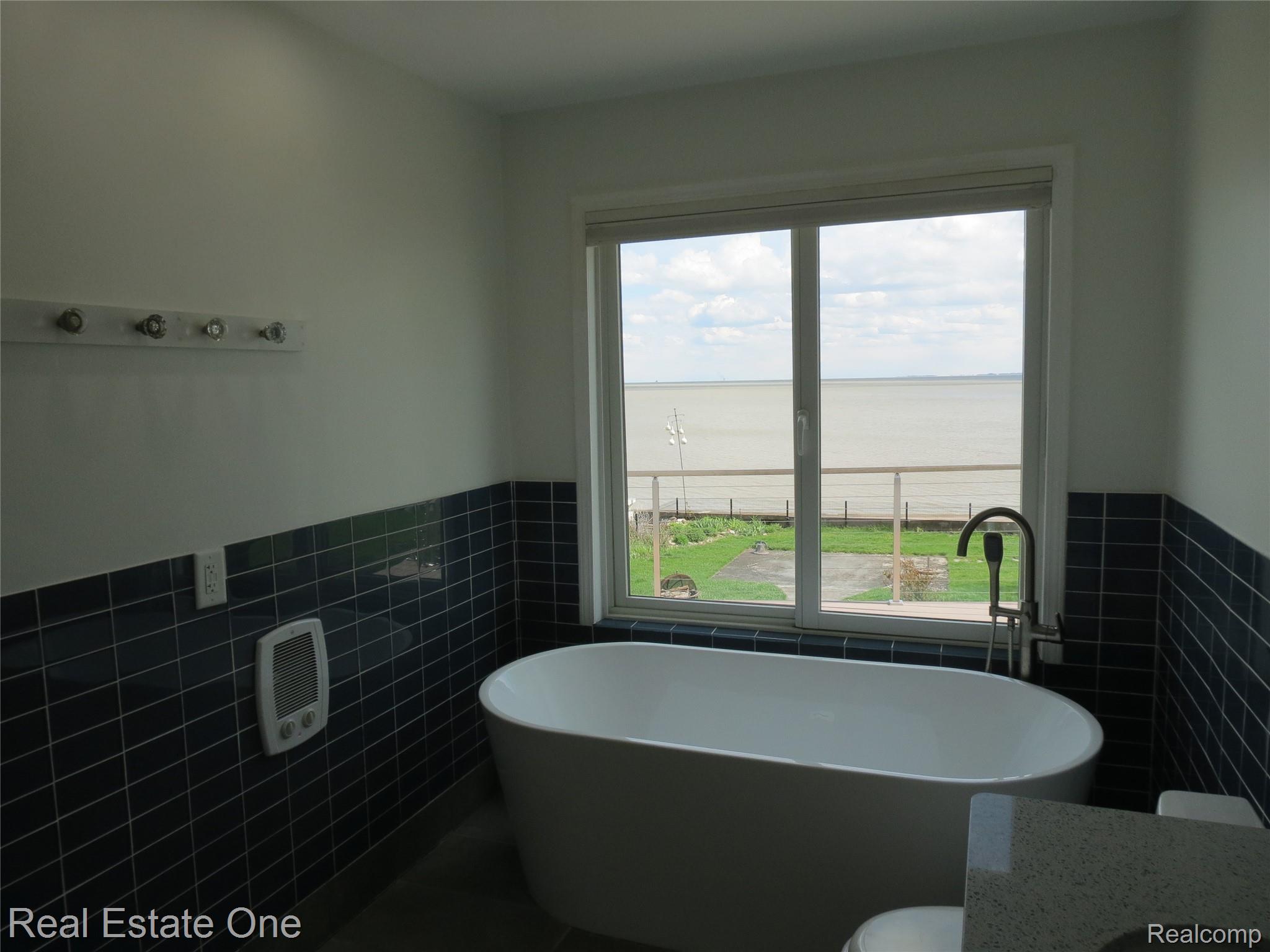 4583 Allen Cove Road Luna Pier, MI 48157 - Photo 31 of 50 Relax in the freestanding large soaking tub.