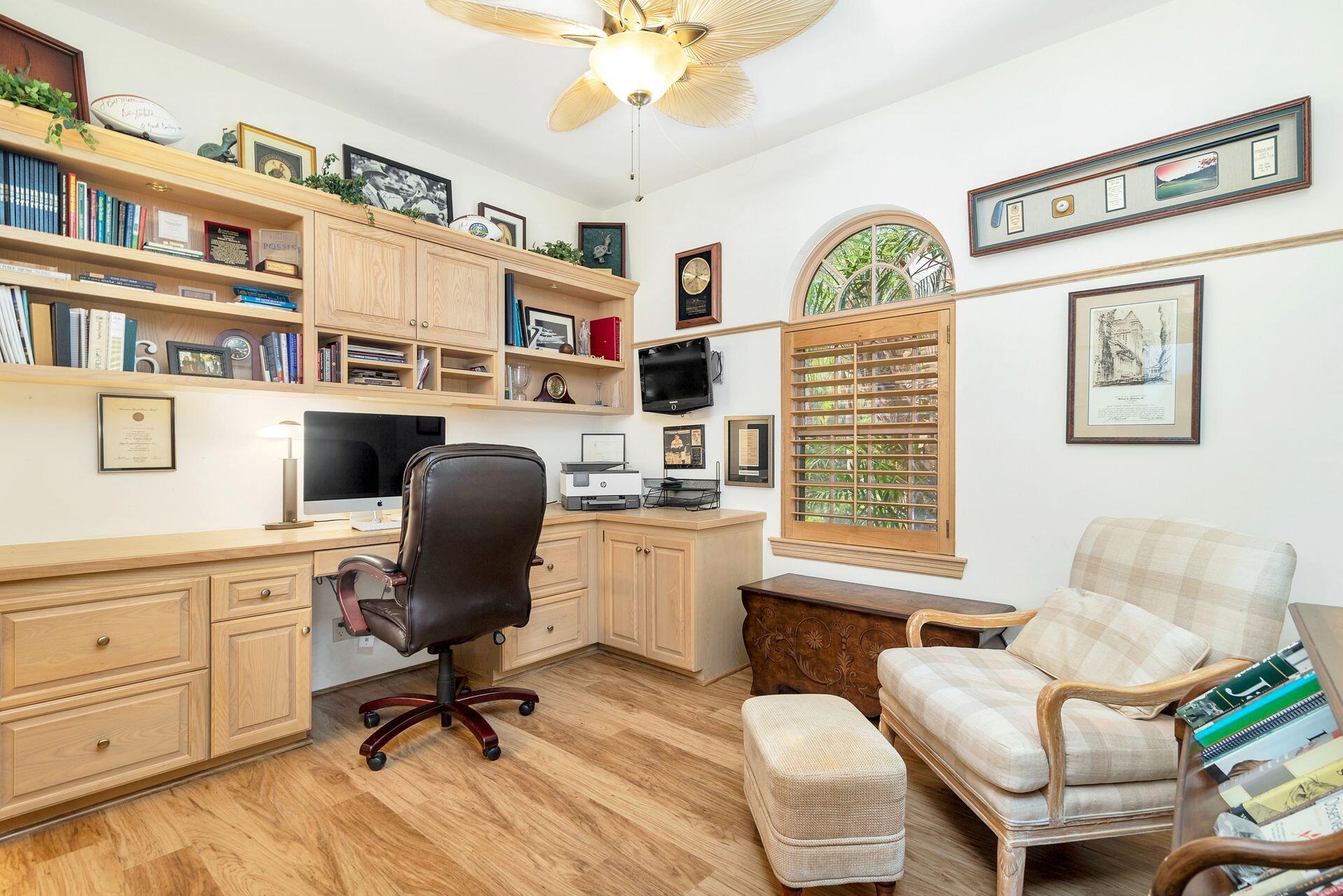 3330 Bridgegate Drive Jupiter, FL 33477 - Photo 17 of 39 a view of a workspace with furniture and a window