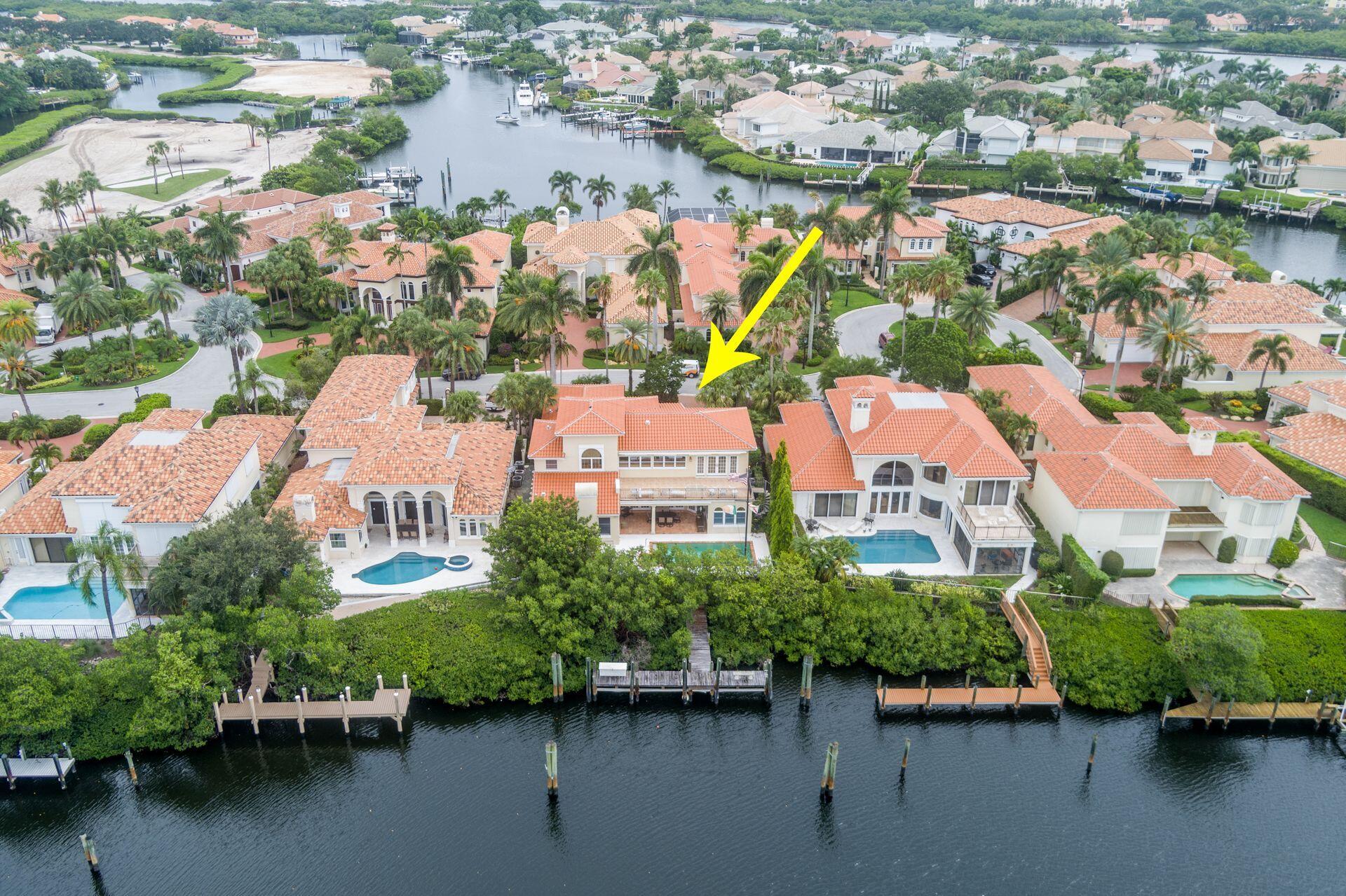 3330 Bridgegate Drive Jupiter, FL 33477 - Photo 2 of 39 an aerial view of house with yard lake view and boat