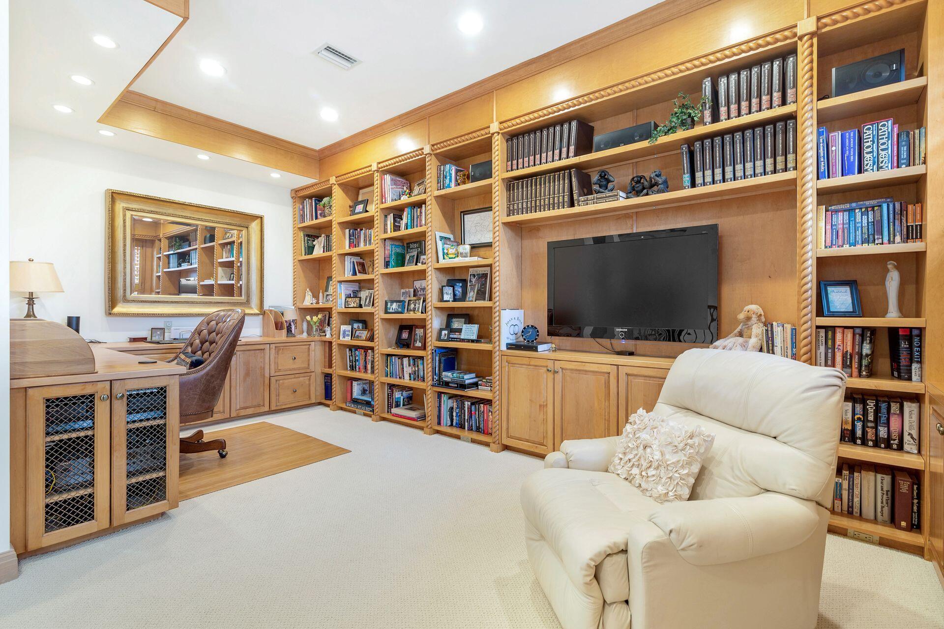 3330 Bridgegate Drive Jupiter, FL 33477 - Photo 22 of 39 a living room with furniture and a flat screen tv
