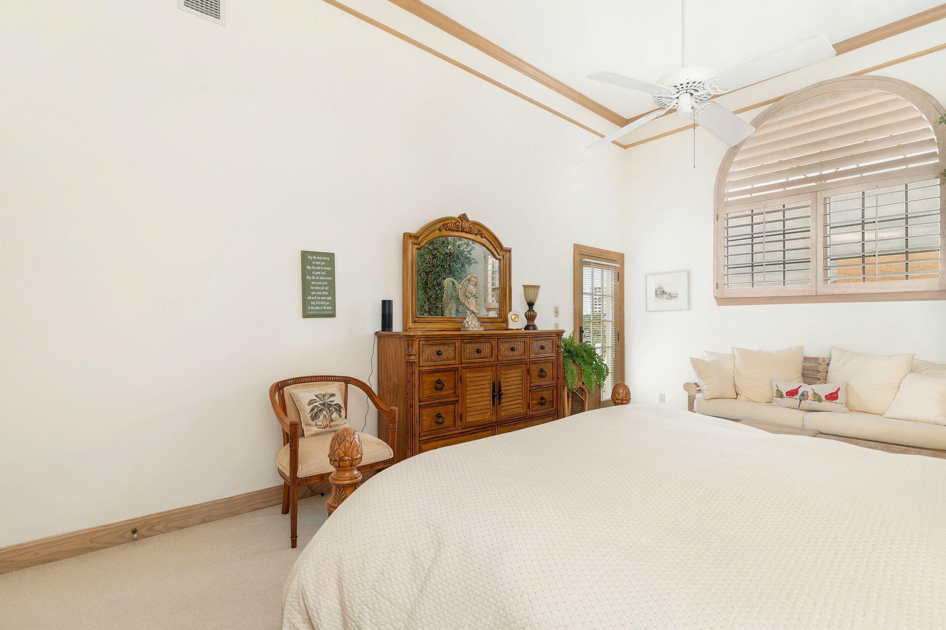 3330 Bridgegate Drive Jupiter, FL 33477 - Photo 27 of 39 a bedroom with a bed and a dresser with the floor