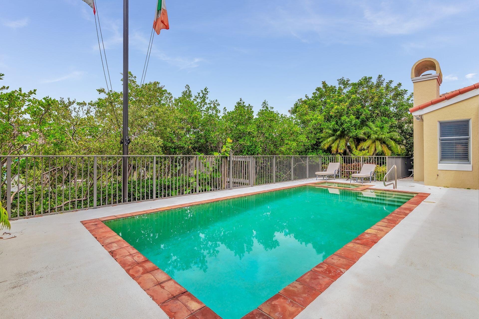 3330 Bridgegate Drive Jupiter, FL 33477 - Photo 33 of 39 a view of a backyard with a lake view