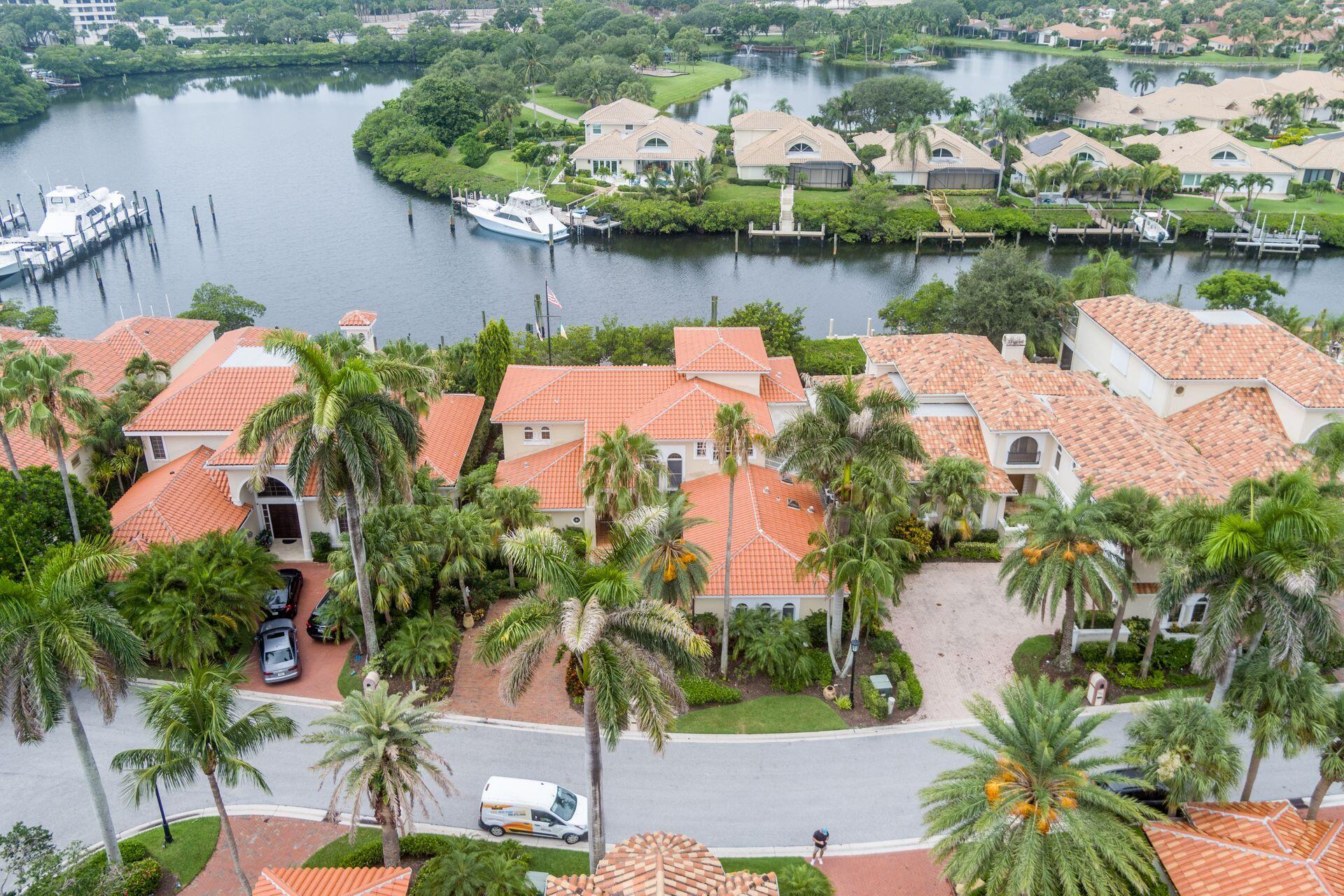 3330 Bridgegate Drive Jupiter, FL 33477 - Photo 36 of 39 an aerial view of a house with garden space and lake view