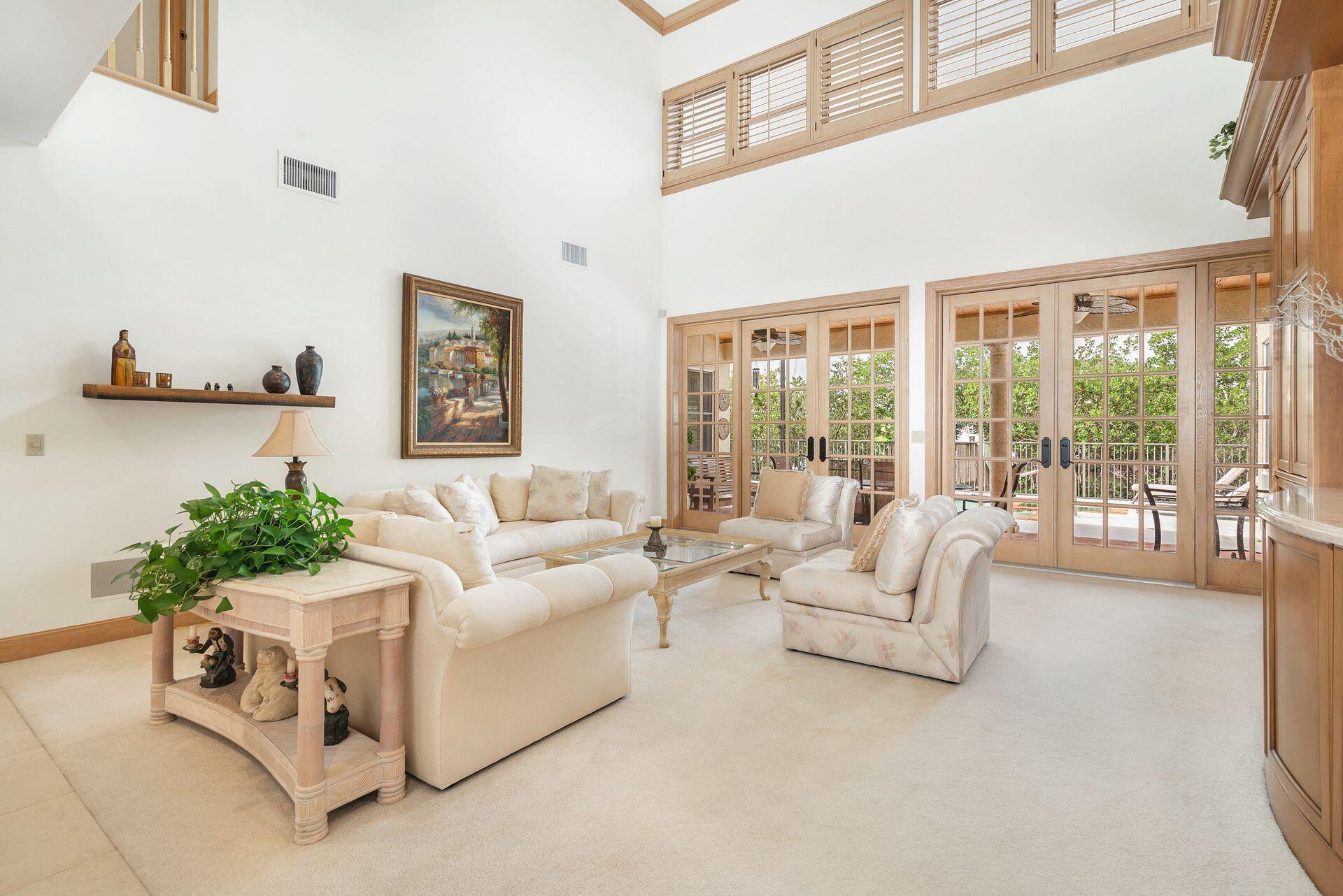 3330 Bridgegate Drive Jupiter, FL 33477 - Photo 6 of 39 a living room with furniture and a large window