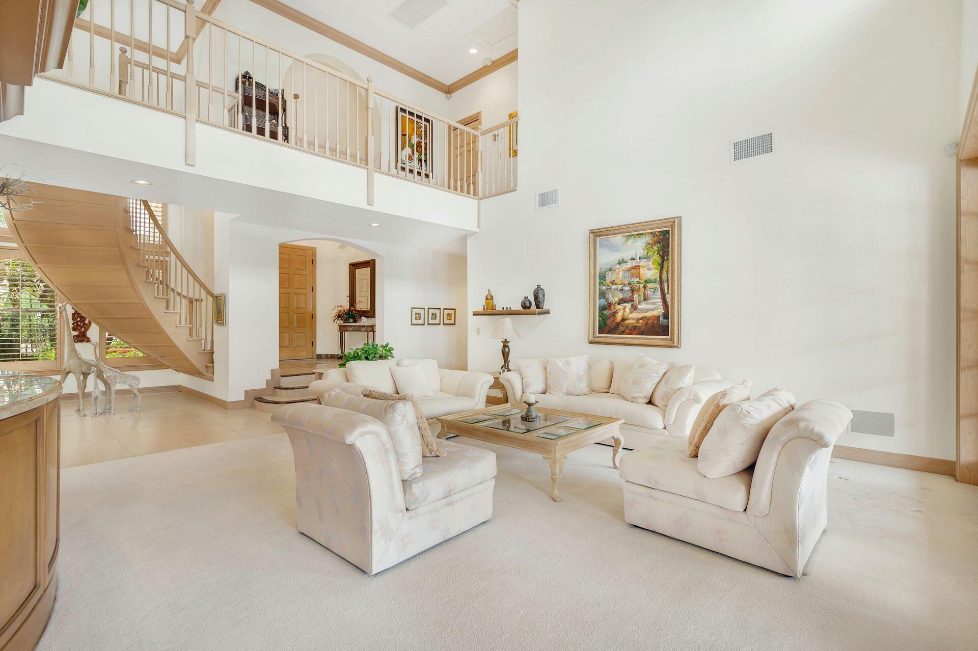 3330 Bridgegate Drive Jupiter, FL 33477 - Photo 8 of 39 a living room with furniture and a large window