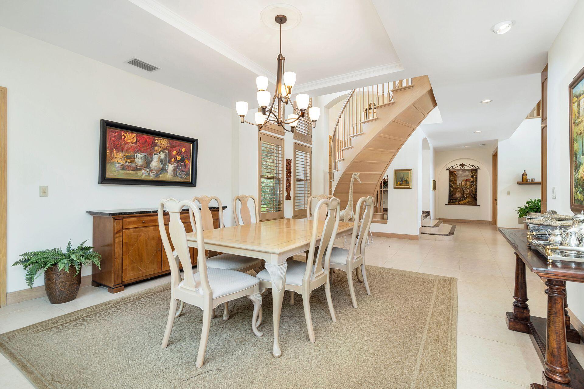3330 Bridgegate Drive Jupiter, FL 33477 - Photo 9 of 39 a view of a dining room with furniture and wooden floor