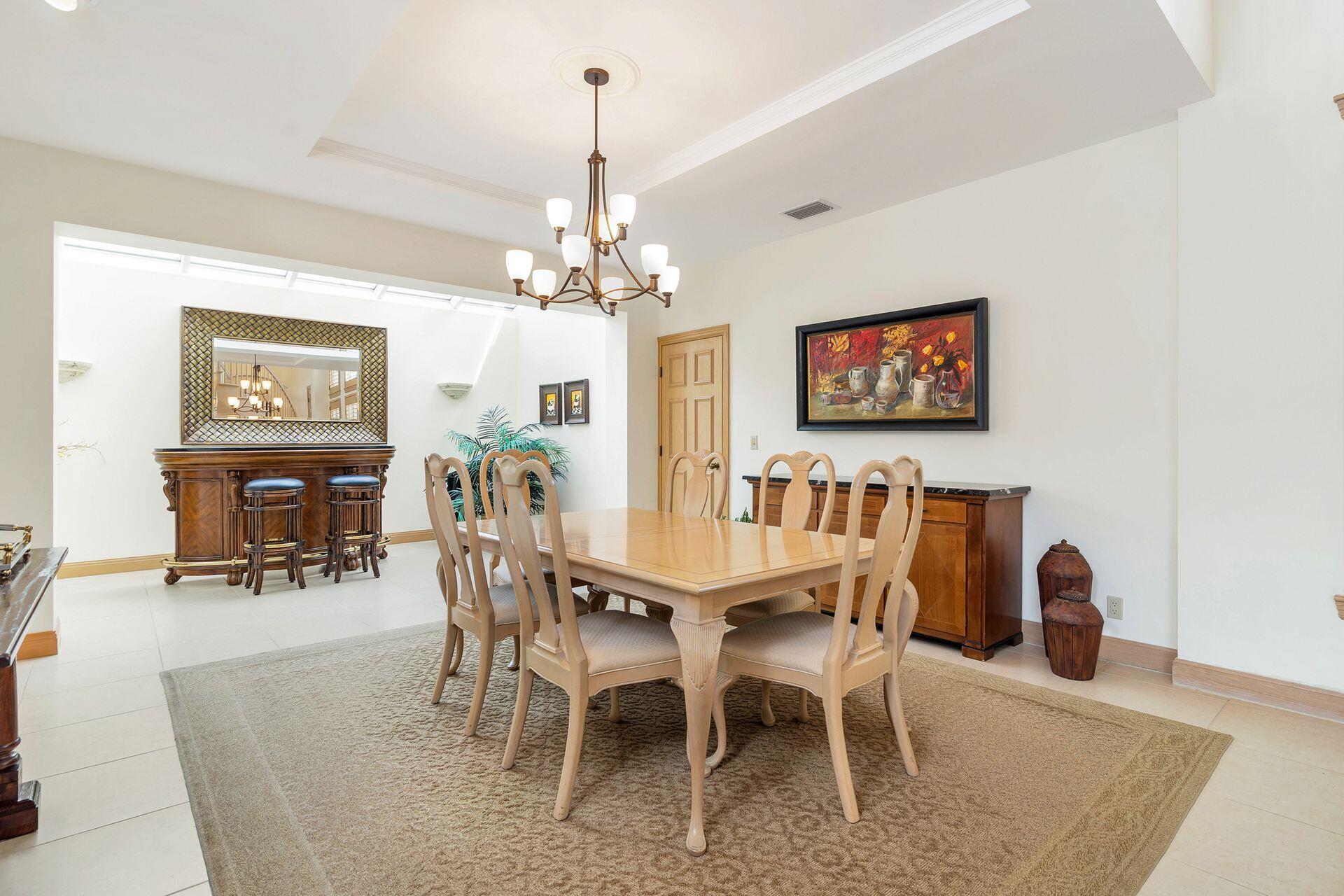 3330 Bridgegate Drive Jupiter, FL 33477 - Photo 10 of 39 a view of a dining room with furniture