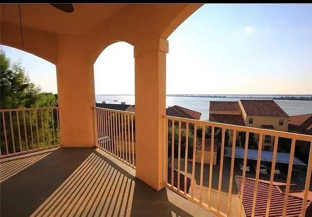 a view of balcony with wooden floor