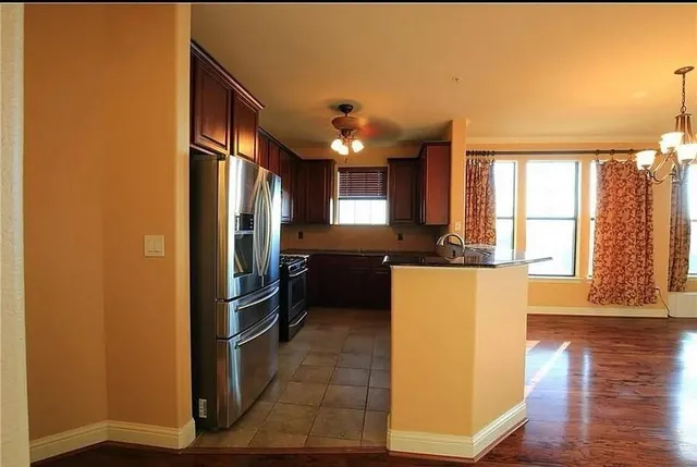 a kitchen with counter top space and stainless steel appliances