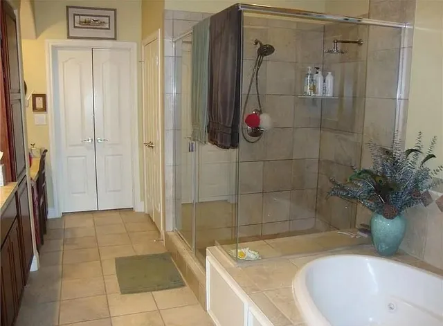 a bathroom with a tub and a shower