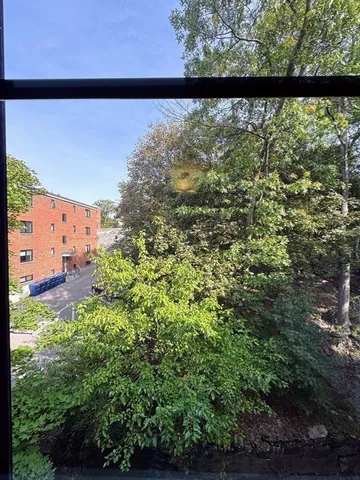 a view of a city street from a balcony
