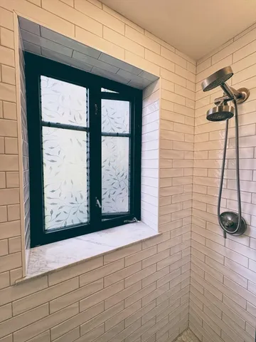 a kitchen with stainless steel appliances a stove a sink and cabinets
