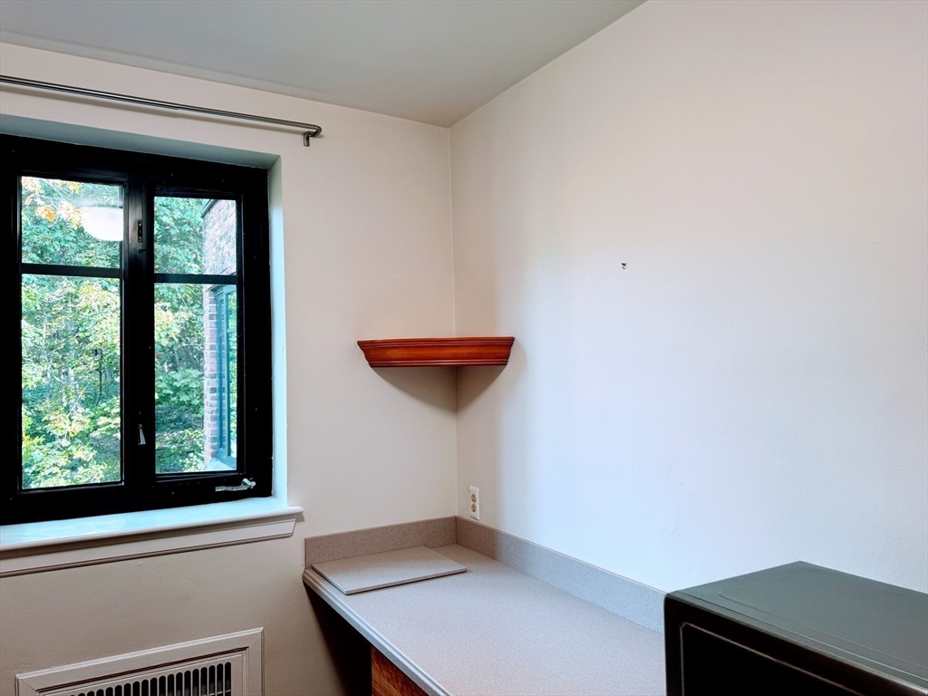 65 Strathmore Road, Unit 49 Boston, MA 02135 - Photo 23 of 26 a view of a small space with a window