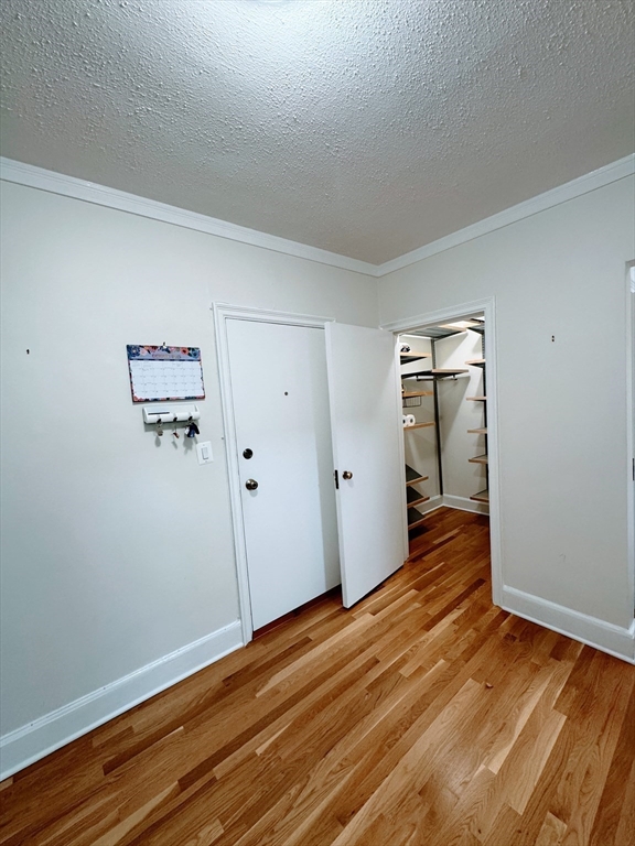 65 Strathmore Road, Unit 49 Boston, MA 02135 - Photo 4 of 26 a view of a room with wooden floor