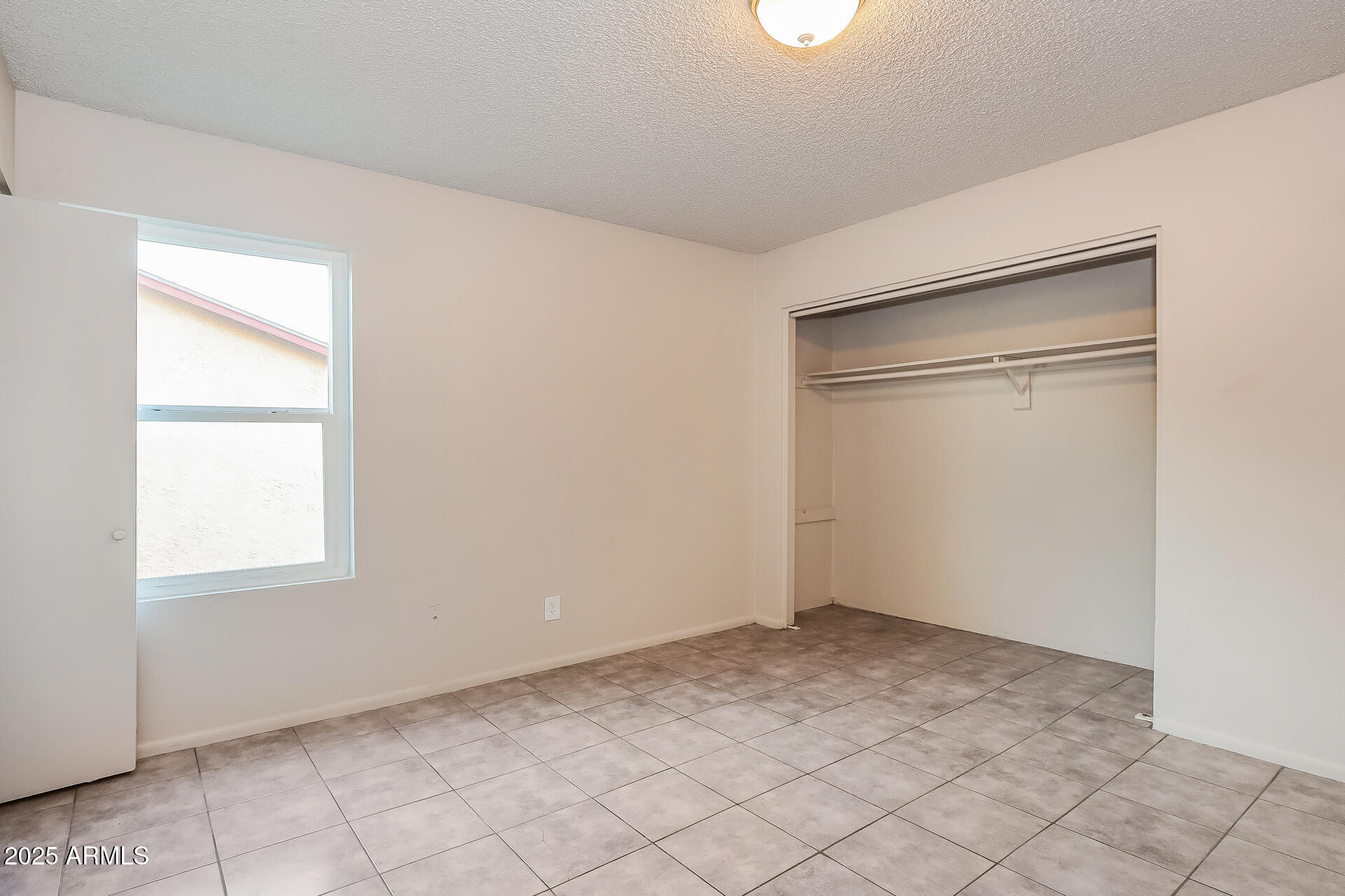 465 West Ivyglen Street, Unit 211 Mesa, AZ 85201 - Photo 10 of 16 an empty room with windows