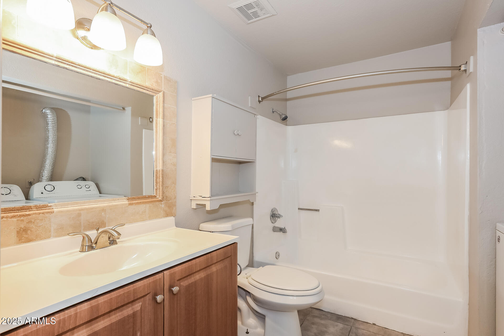 465 West Ivyglen Street, Unit 211 Mesa, AZ 85201 - Photo 11 of 16 a bathroom with a sink toilet and shower
