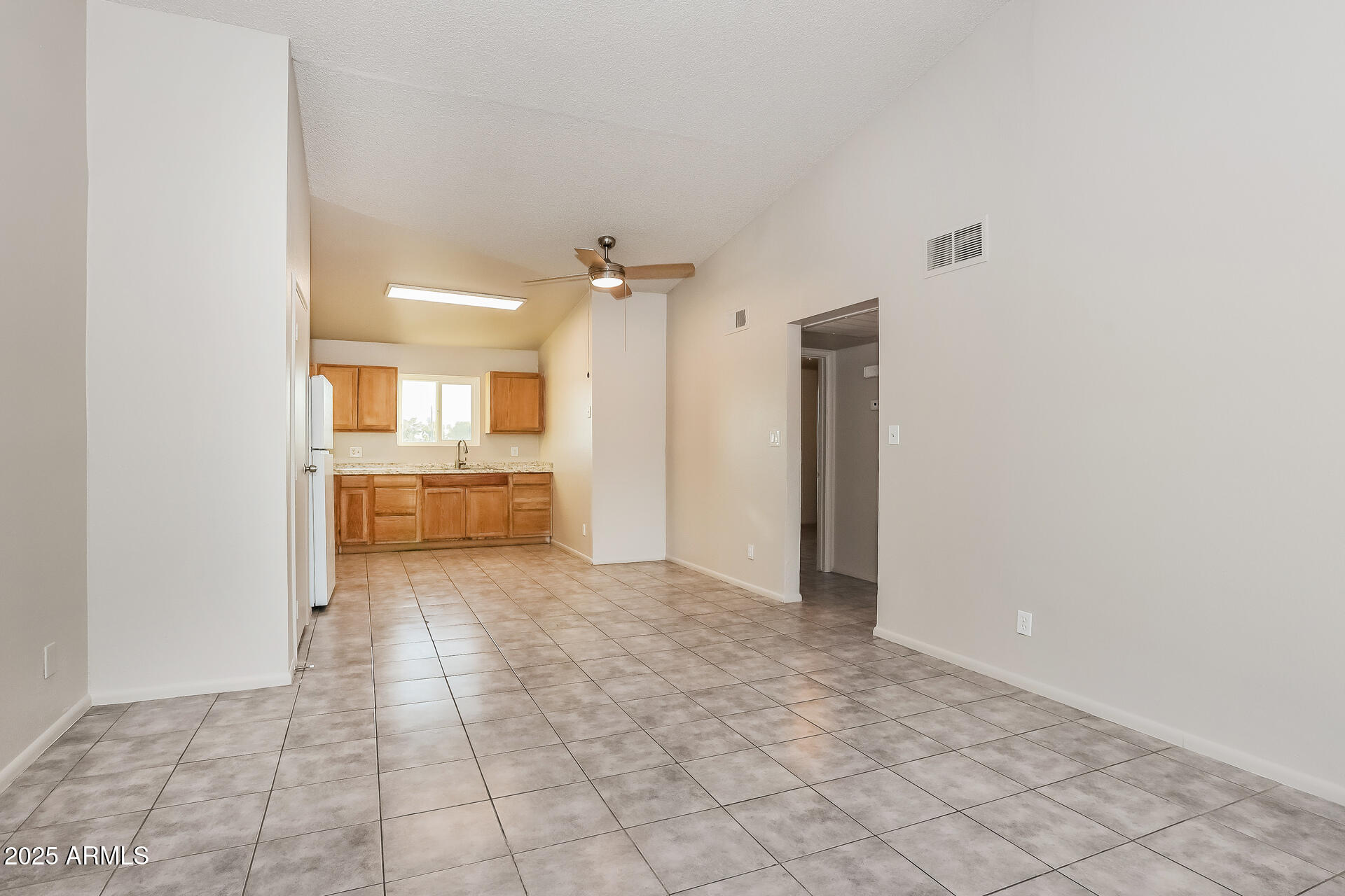 465 West Ivyglen Street, Unit 211 Mesa, AZ 85201 - Photo 3 of 16 a view of a kitchen with a sink and cabinets