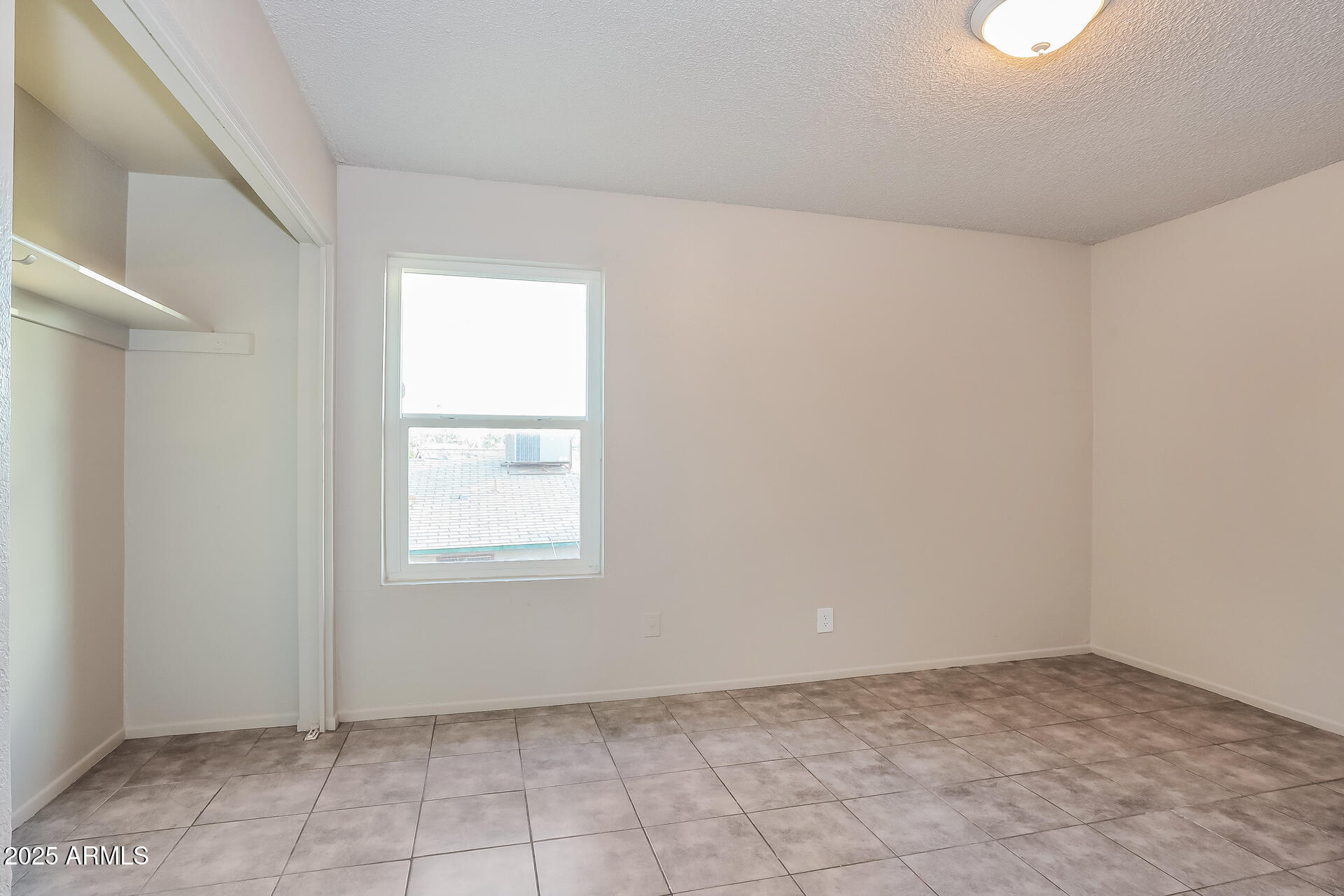 465 West Ivyglen Street, Unit 211 Mesa, AZ 85201 - Photo 8 of 16 an empty room with windows