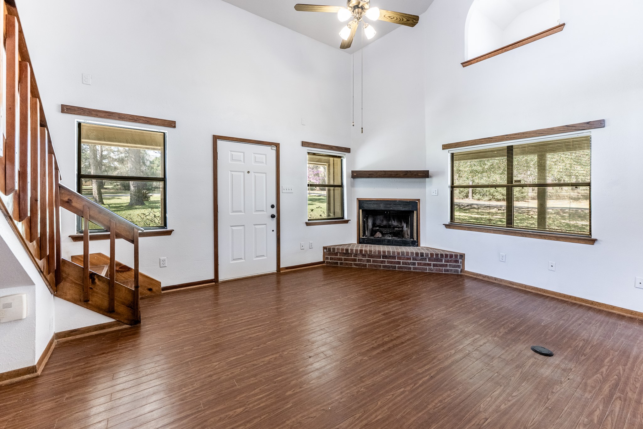 191 Timber Bay Drive Trinity, TX 75862 - Photo 5 of 48 Living room with Tall Ceilings and Wood Burning Fireplace.