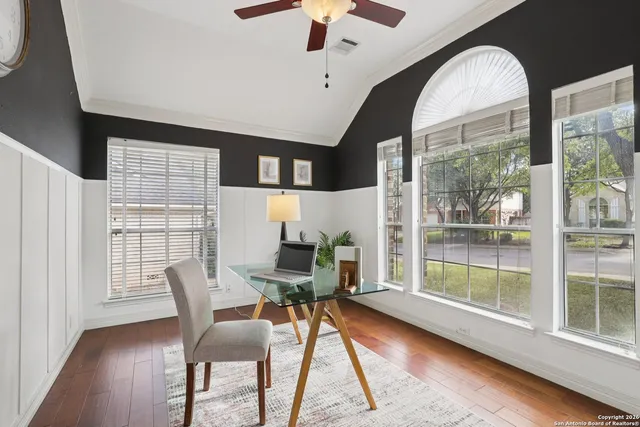 a view of a dining room with furniture window and wooden floor