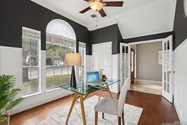 a view of a livingroom with furniture and kitchen view