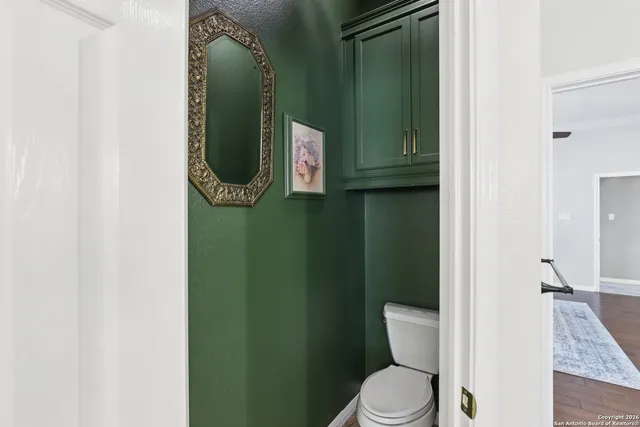 a bathroom with a toilet and a sink