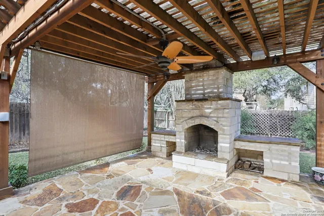a view of a livingroom with a fireplace and a garage