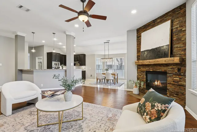 a living room with furniture and a fireplace