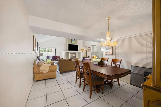 a view of a livingroom with furniture and a window