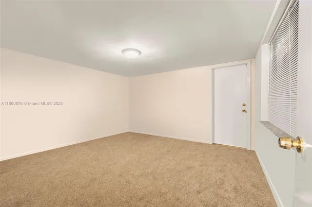 an empty room with a empty space and windows