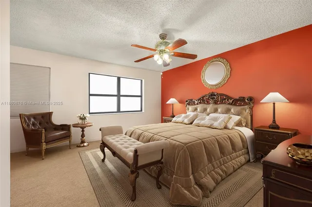 a bedroom with bed and window