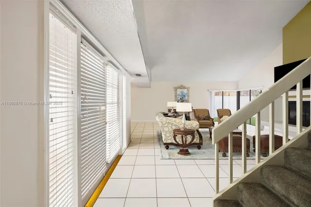 a balcony with chairs and stairs