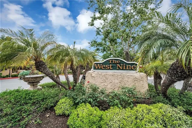 a view of multiple houses with a yard
