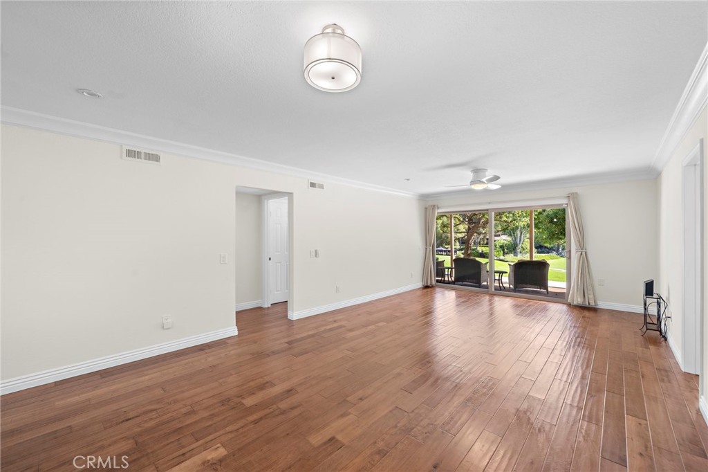 31654 West Nine Drive Laguna Niguel, CA 92677 - Photo 25 of 57 an empty room with wooden floor and windows