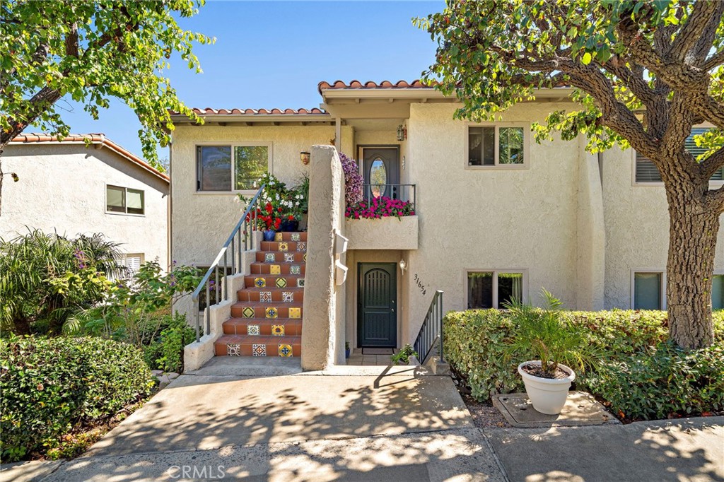 31654 West Nine Drive Laguna Niguel, CA 92677 - Photo 27 of 57 a front view of a house with garden