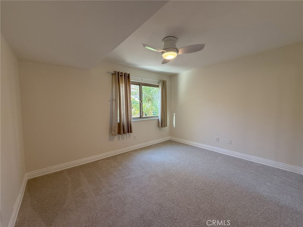 31654 West Nine Drive Laguna Niguel, CA 92677 - Photo 10 of 57 an empty room with windows and chandelier fan