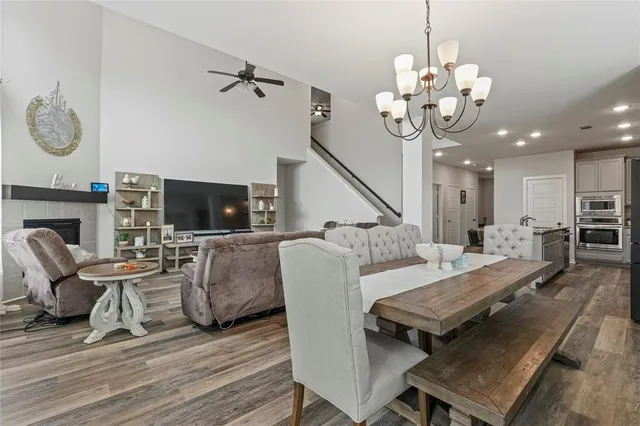 a large kitchen with kitchen island a counter space a sink appliances and cabinets