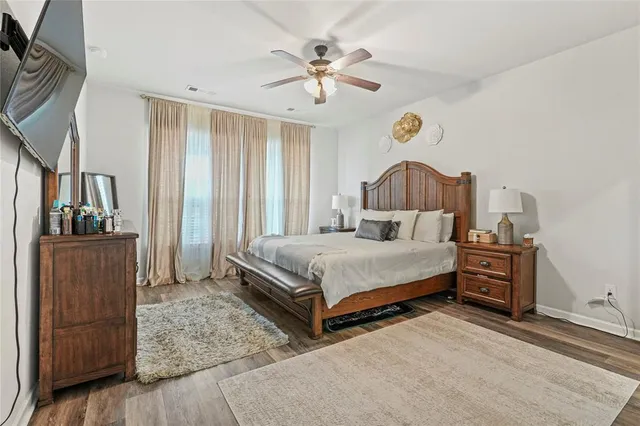 a living room with furniture a fireplace and a table