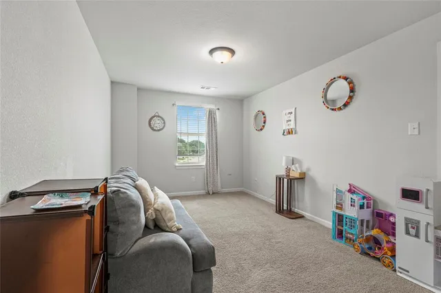 a bathroom with a sink mirror vanity and toilet