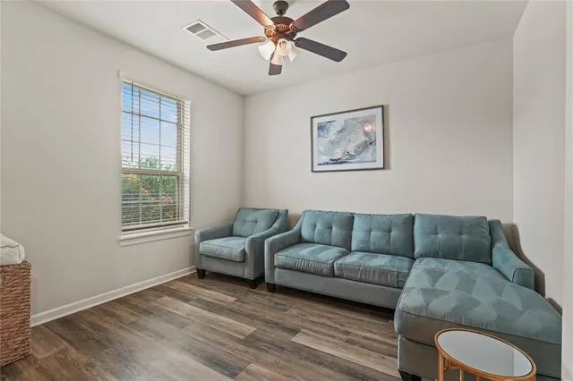 a living room with furniture and a window