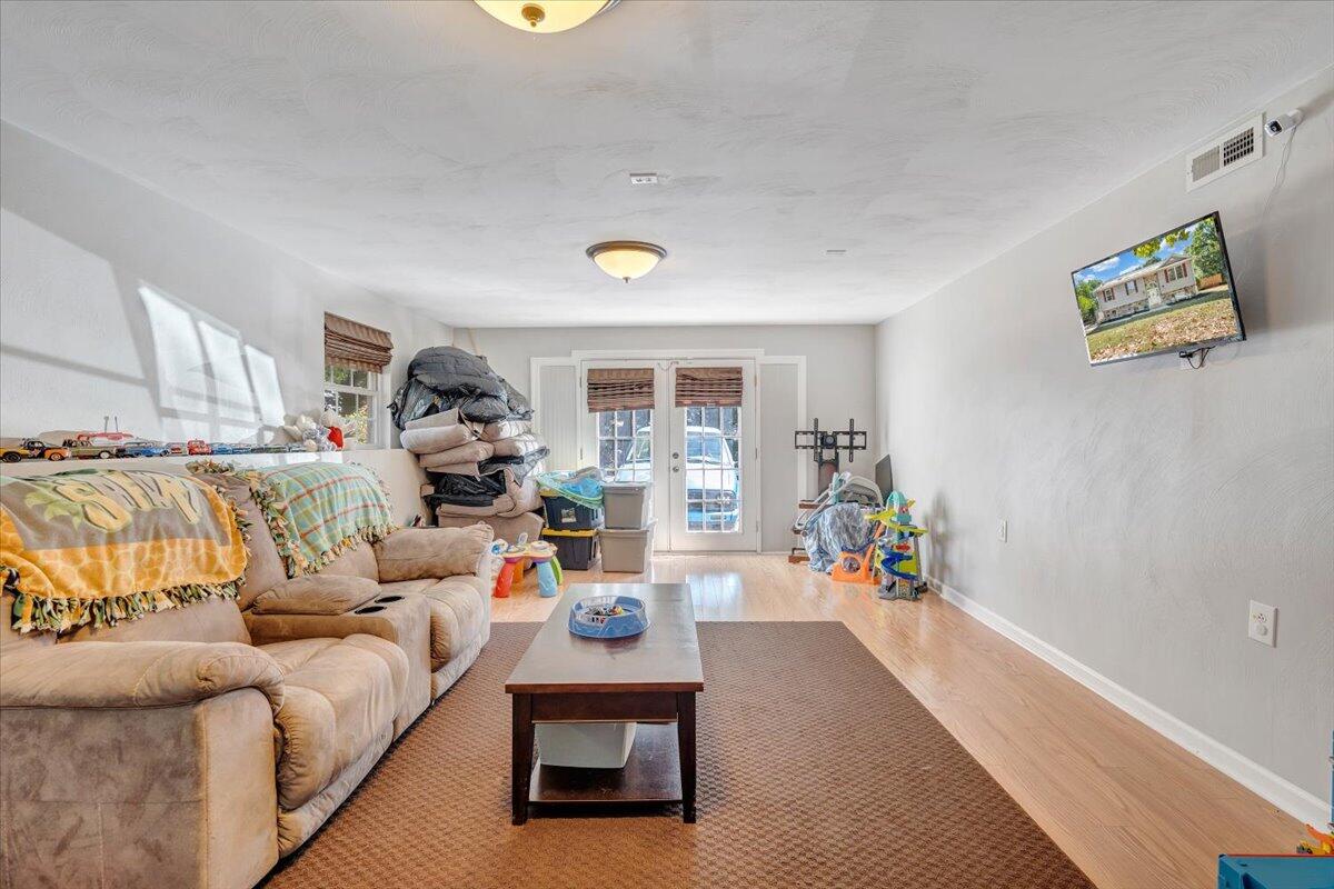 1063 Colony Court Moneta, VA 24121 - Photo 41 of 60 a living room with furniture and a wooden floor