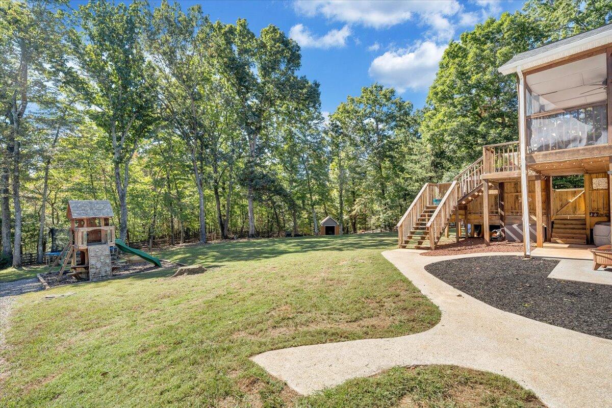 1063 Colony Court Moneta, VA 24121 - Photo 44 of 60 a view of a yard with swings