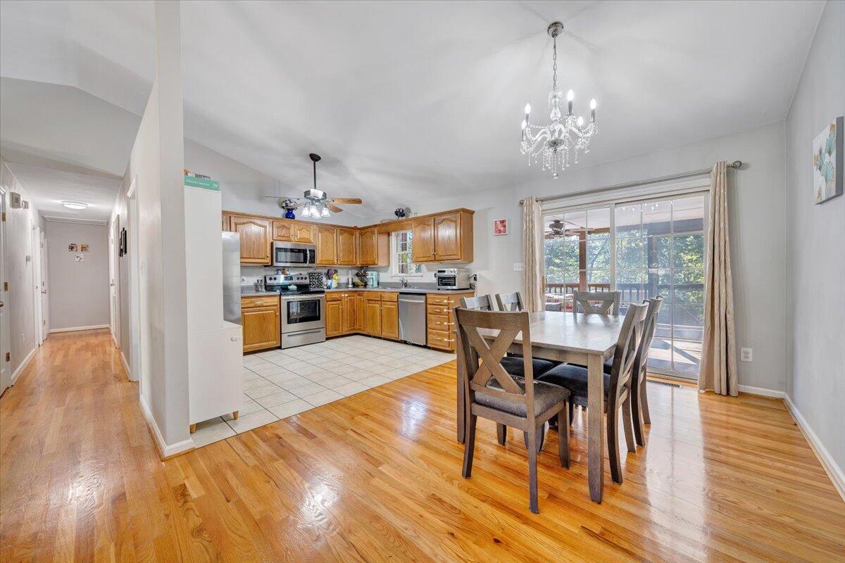 1063 Colony Court Moneta, VA 24121 - Photo 9 of 60 a view of a dining room with furniture window and wooden floor