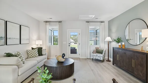 a kitchen with granite countertop a stove a sink and a refrigerator