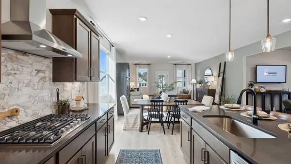 a en suite bathroom with double vanity sinks and a mirror